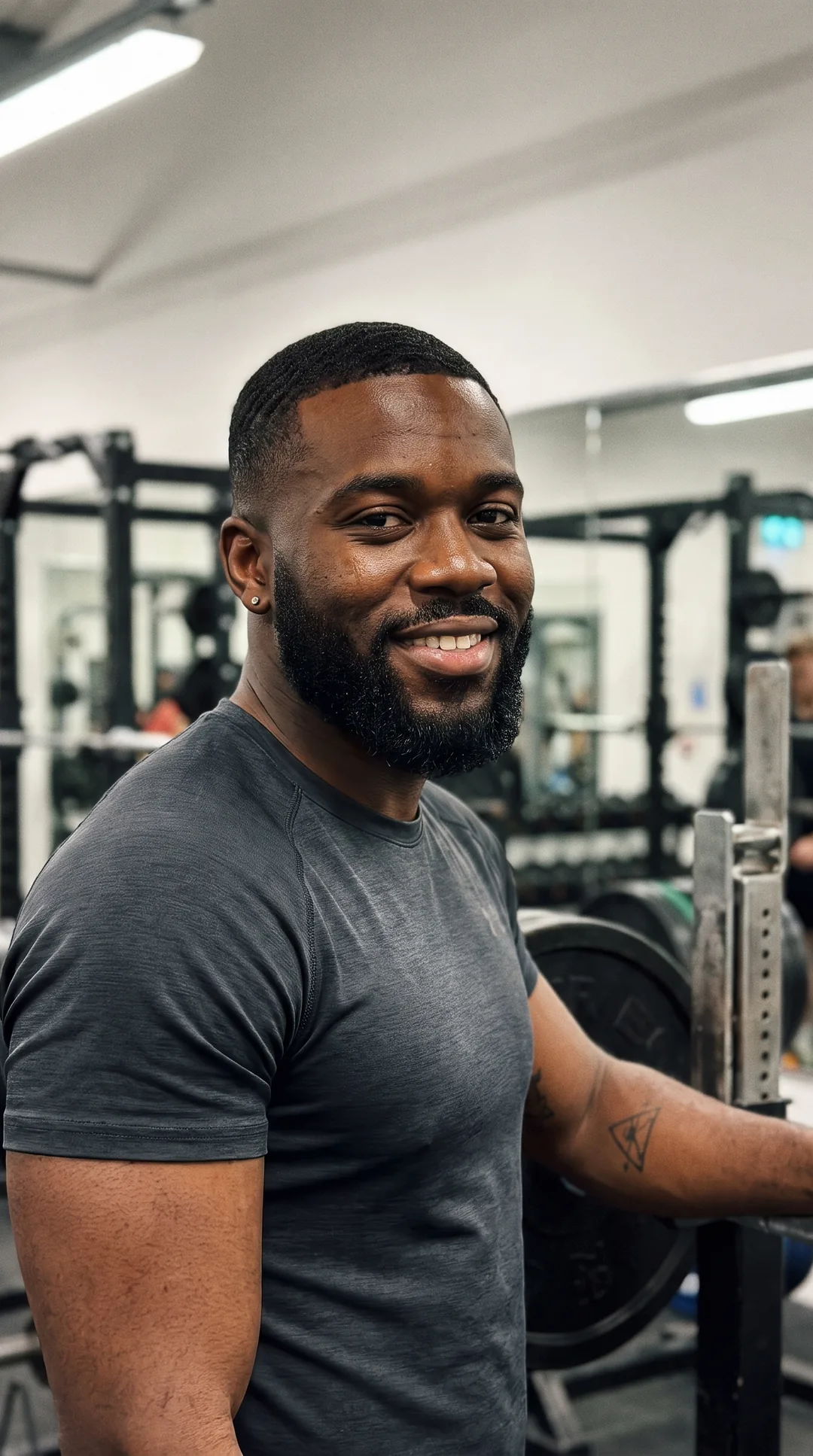Strength & conditioning coach running a paid online session from a UK gym