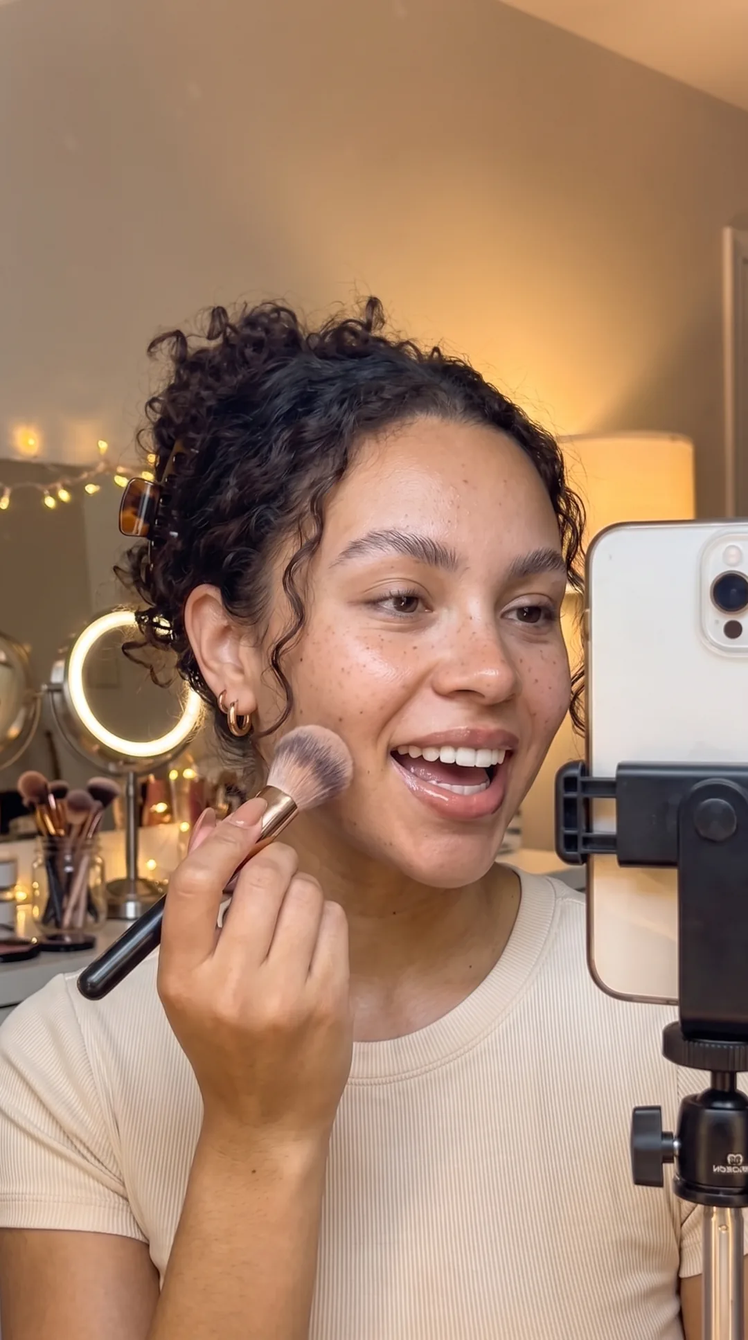 Beauty creator running a paid live makeup session from her phone at home